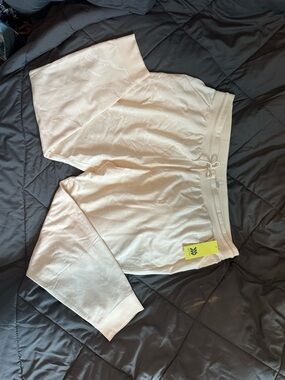 All in Motion Cream color with white print joggers/sweatpants